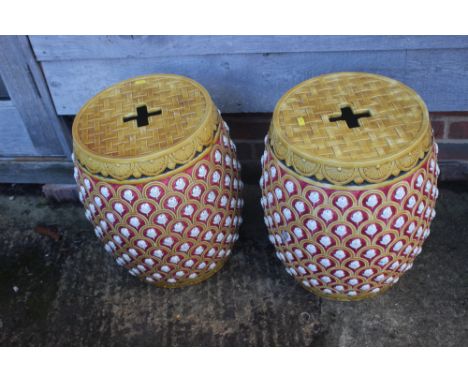 A pair of Minton-type majolica barrel garden seats, 19" highCondition:One has numerous heavy cracks around the body, both hav