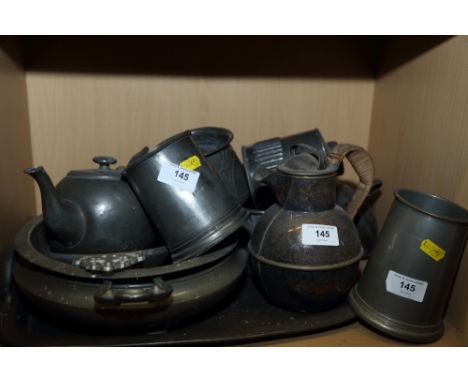 A quantity of pewter, including a Jersey jug, 7 1/4" high, a teapot, a tea caddy and other items 