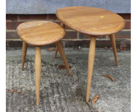 Two Ercol light elm pebble tables, larger 19 1/2" wide x 13 1/4" deep x 14 1/2" high, smaller: 13 1/2" wide x 10" deep x 13" 