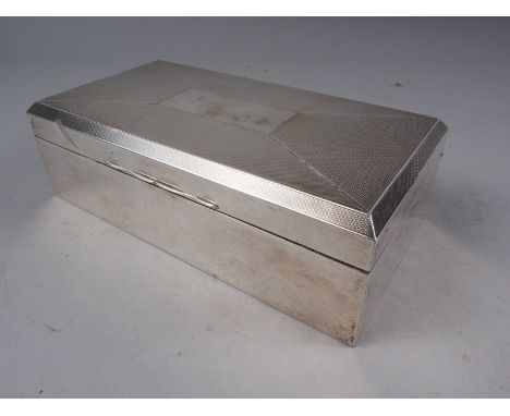 A silver engine turned cigarette box, 6 1/2" wide