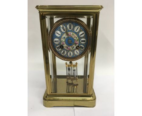 A four glass mantel clock the circular dial With Severs style dial with Mercury pendulum. 24 cm .