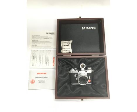 A boxed Minox digital classic camera with associated paperwork.