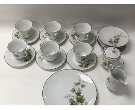 An RC Noritake porcelain tea set. 6 tea cups, 6 saucers. 6 side plates, one sugar pot. One milk jug. One main plate. (One sid