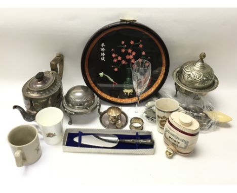 A box containing items of silver plate, a silver napkin ring and ceramic plates as well as an assortment of oddments.