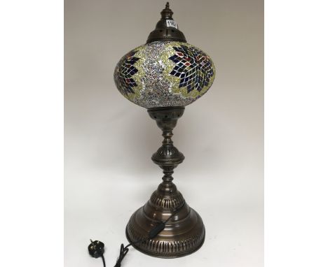 A large Moorish style lamp on large circular base. Height 80cm approx - NO RESERVE