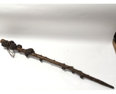 A hawthorn walking stick, measuring approximately 94cm in length. Complete with what appears to be leather cord for hanging.