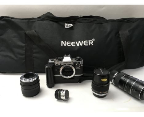 An Olympus camera, sets of lenses and photographic lighting equipment.