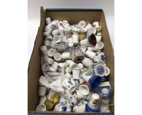 A large collection of thimbles that vary in ages. Also some small ceramic items in amongst the lot. NO RESERVE