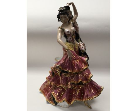 An Italian ceramic vase attached to a dancing lady figure. Height 47cm approx