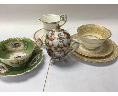 A 19 th century chocolate pot and cover and three hand gilt cups and saucers.