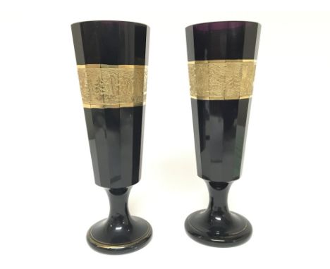 A pair of quality 1920-30 amethyst coloured cut glass vases decorated with an embossed band of gilt decorated with chinoiseri