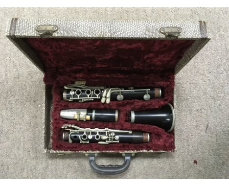 A vintage cased clarinet by Penzel-Mueller, New York.