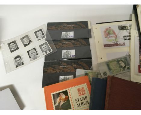 A collection of stamps and an album of coins including Royal Mail high value stamp packs old Ã‚Â£1 banknotes commemorative st