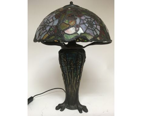 A Tiffany style lamp decorated with Flowers and spiderwebs. Height 54cm approx - NO RESERVE