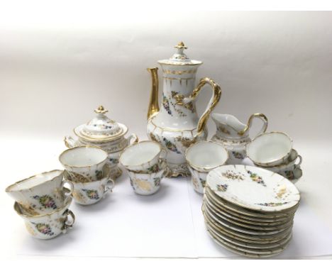 An ornate tea set with 9 tea cups, 11 saucers, one lidded pot, one milk jug and one tea pot. Various items are damaged - NO R