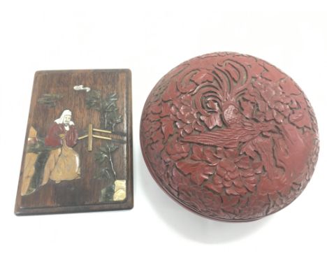 A circular Chinese lacquered box and a small panel, approx 11cm x 16cm.