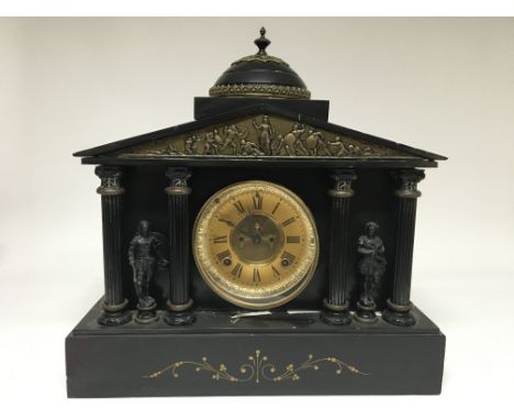 A black slate mantle clock with circular dial having Roman numerals. Height 41cm x 42cm