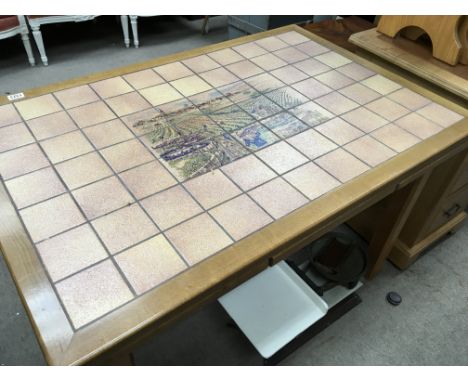 A modern light wood French dining table the top inset with tiles depicting a grape harvest the top with two pull out extra le