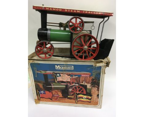 A boxed Mamod steam tractor in original box .