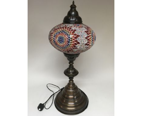 A standard lamp in the Moorish style with 7 graduated shades, with multicolour inset, supported by a spiral stem. Height 148c