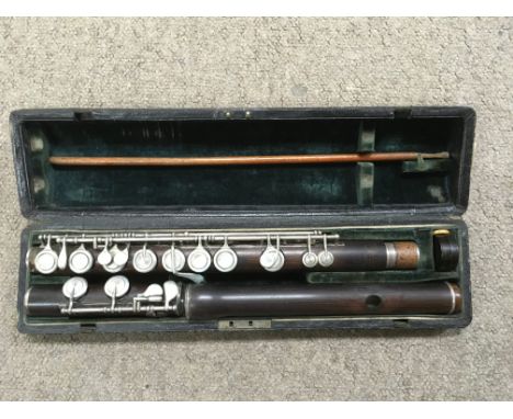 A cased vintage Rundall Carte &amp; Co Ebony flute.