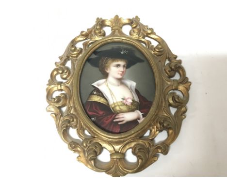 A Quality late 19th century porcelain plaque depicting a half length portrait of a lady wearing robes the reverse with applie