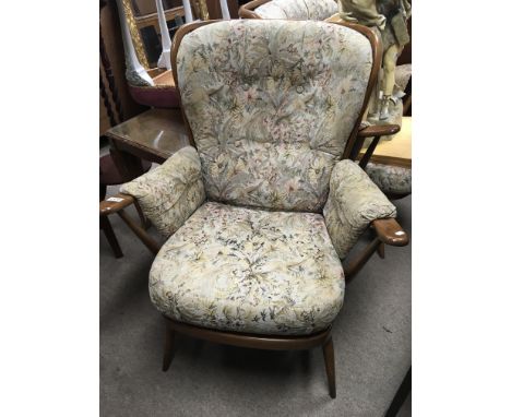 A pair of cottage style Ercol arm chairs with floral upholstery (2)