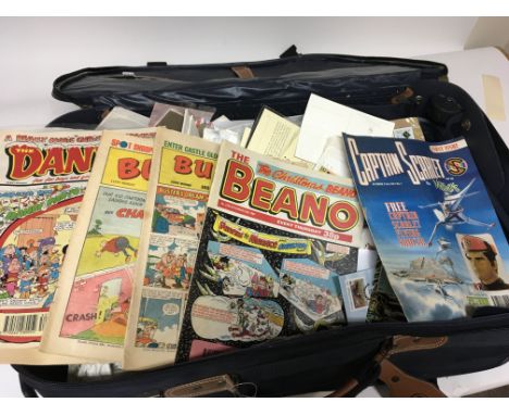 A case containing a collection of first day covers stamps and comics including fist issue Captan Scarlet and a few others (a 