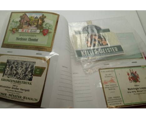 Album of vintage German wine labels and Kensitas silks and a 100,000 Mark banknote 