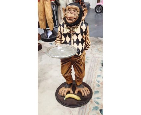 Life sized chimpanzee dumbwaiter with tray and banana H: 100 cmCondition Report: Very light scratches to the top of the eyebr