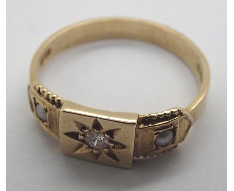 A vintage 9ct gold ring having a central diamond flanked by two seed pearls, in the Victorian style. 2.5g, size P 