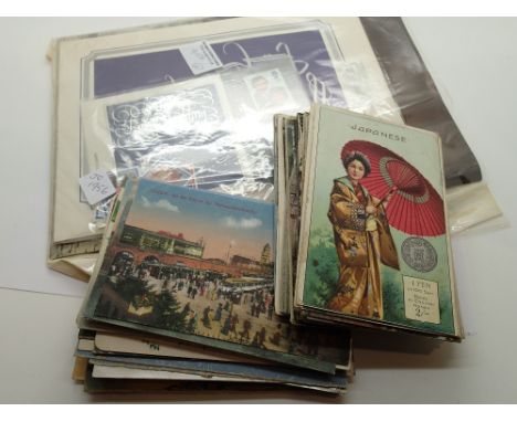 Collection of vintage postcards and photographs together with a small collection of stamps 