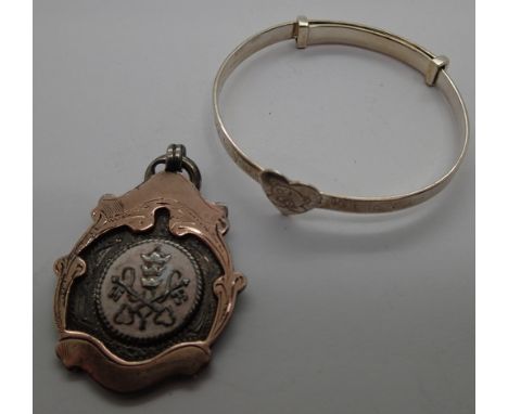 Sterling silver bangle and a silver and gold watch chain fob 