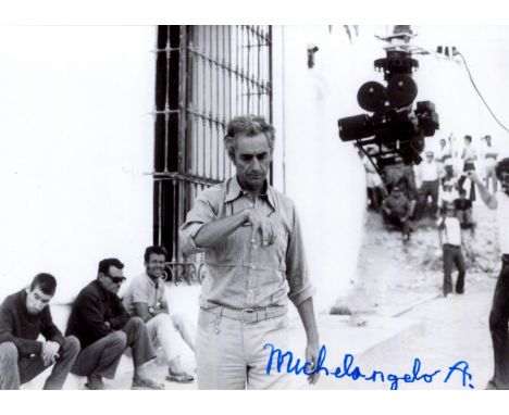 ANTONIONI MICHELANGELO: (1912-2007) Italian film director. Signed 7 x 5 photograph of Antonioni standing outdoors in a three-