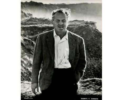 ZANUCK DARRYL F.: (1902-1979) American film producer and studio executive. Signed 8 x 10 photograph of Zanuck standing outdoo