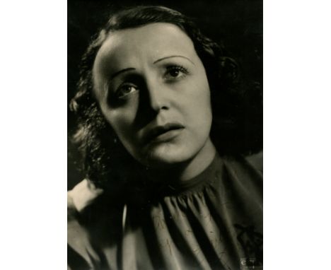 PIAF EDITH: (1915-1963) French singer. Vintage signed and inscribed 6.5 x 9 photograph of Piaf in a head and shoulders pose. 
