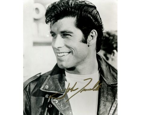 TRAVOLTA JOHN: (1954-     ) American actor. Signed 8 x 10 photograph of Travolta in a head and shoulders pose in costume as D
