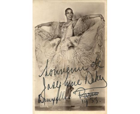 BAKER JOSEPHINE: (1906-1975) American-born French entertainer. Vintage signed sepia postcard photograph of Baker standing in 