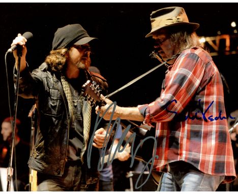 YOUNG & VEDDER: YOUNG NEIL (1945-     ) Canadian-American musician & VEDDER EDDIE (1964-     ) American singer, lead vocalist
