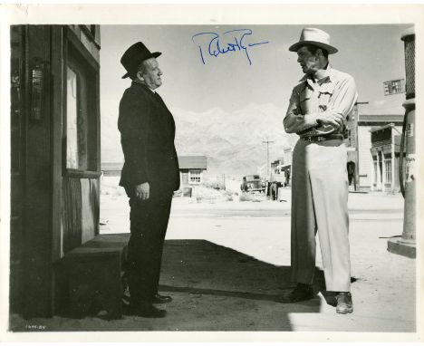 RYAN ROBERT: (1909-1973) American actor. Vintage signed 10 x 8 photograph or Ryan standing outdoors in a full-length profile 