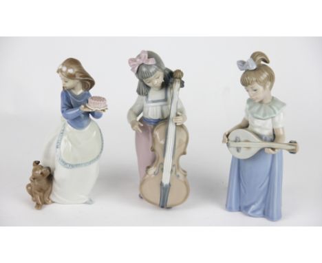 Three NAO figures, to include; a girl holding a cake her dog to her side, 18.5cm high, a girl playing a mandolin, 19.5cm high