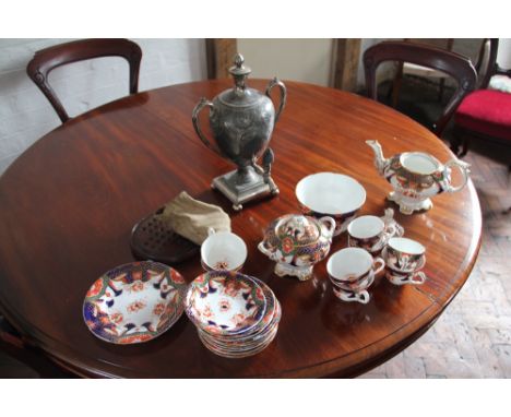 A 19th Century Staffordshire Imari pattern part tea service; a Britannia metal tea urn and a solitaire board with various gla