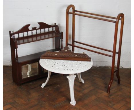 An Edwardian mahogany bathroom cabinet, with two doors, 67cm x 63cm; with a mahogany towel rail; a carved and inlaid walnut w