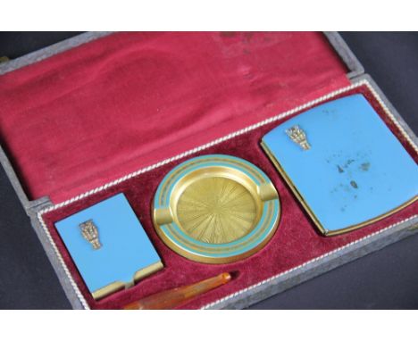 A lady's cased smoking companion set, 1940's, the fitted case containing; cigarette case, vest case, ash tray and cheroot (la
