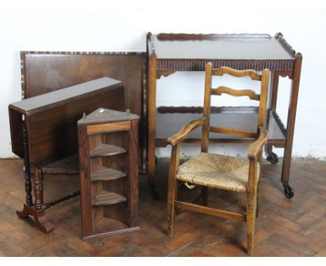 A beech ladder back childs chair, with rush seat; a mahogany Sutherland table; an oak two tier trolley; a small hanging corne