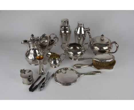 Two silver backed dressing table brushes and a hand mirror along with a collection of silver plated wares to include; a four 