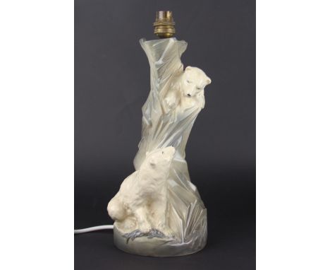 An Art Deco Bretby pottery table lamp, modelled as two Polar Bears beside a glacier, impressed marks, 30cm