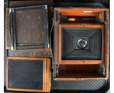 An early Eastman Kodak Co leather mounted mahogany camera, with black bellows and one plate, 21cm
