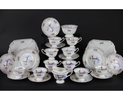 A Shelley Versailles pattern tea service, 11426, fruit and exotic bird decorated, comprising 12 tea cups, 12 saucers, 12 side