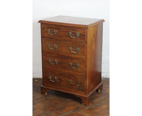 A small mahogany chest, of four graduated long drawers, on bracket feet, 80cm x 57cm x 41cm